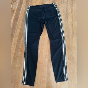 Athleta women’s large black leggings with white piping. Like new.